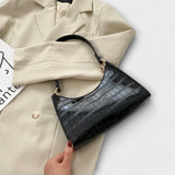 Lora - Kiiltävä nahkainen laukku